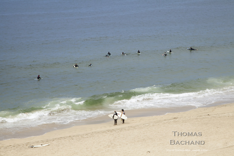 Surfers.  Watching.